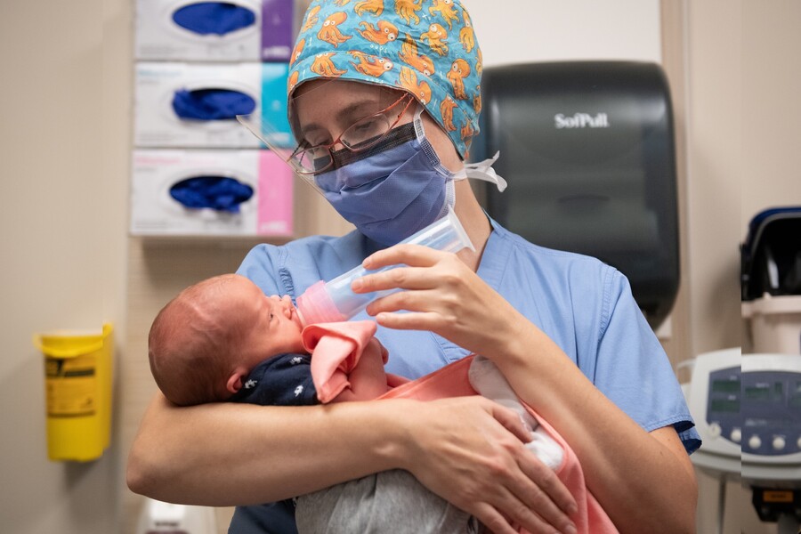 Dr. Anne Berndl holding a baby