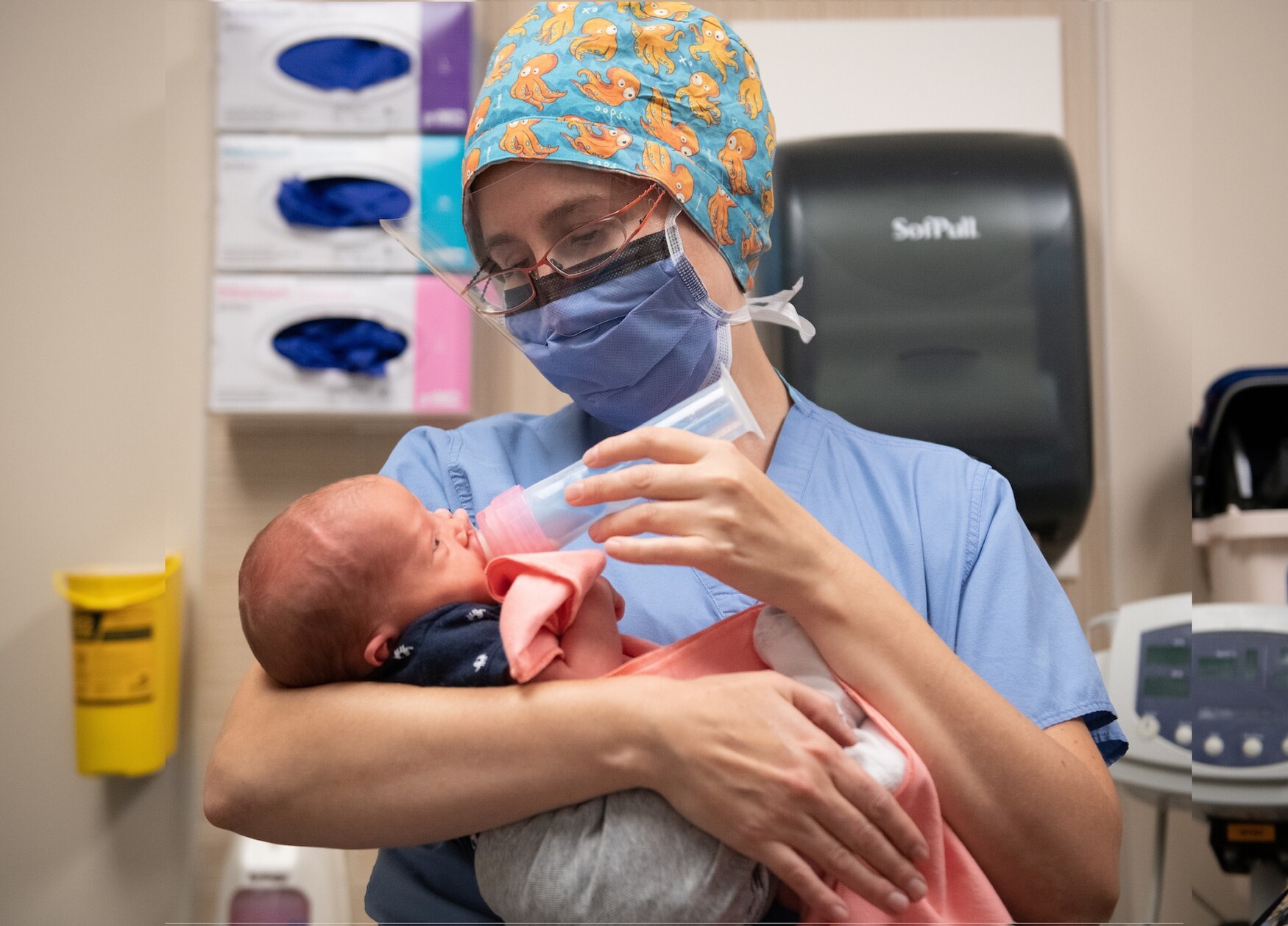 Dr. Anne Berndl holding a baby